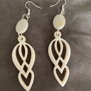 White resin dangle earrings pierced ear